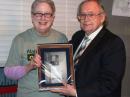 Tom Clark, K3IO, receives the ARRL Presidents Award from ARRL President Kay Craigie, N3KN. [Bob McGwier, N4HY, photo]